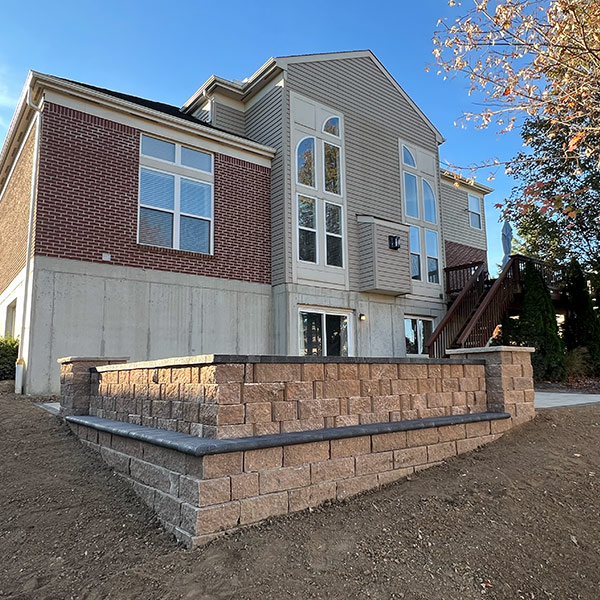 Stone patio with seating wall